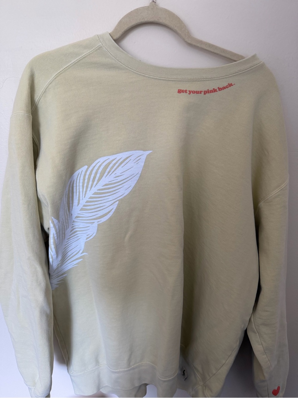 Source Unknown Pale Green Sweatshirt with White Feather Graphic and Pink Accent